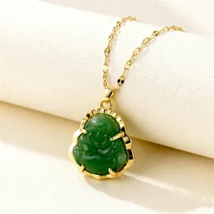 Macro detail of dark green Buddha pendant with radiating gold texture and thin chain