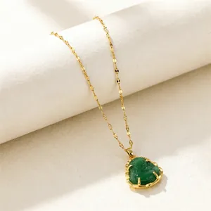 Close-up of green jade Maitreya Buddha pendant with gold plated chain necklace