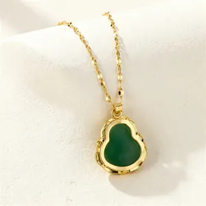 Detailed close-up of a green chalcedony gourd pendant on a dainty gold chain necklace