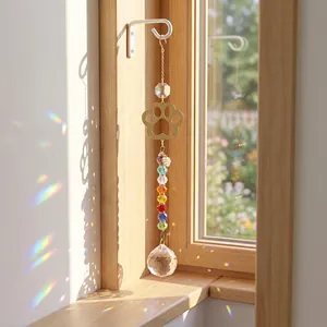 Rainbow crystal suncatcher with golden paw print metal charm and faceted glass ball
