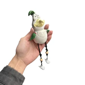 Funny resin chicken garden statue with cartoonish expression and hanging legs for decor