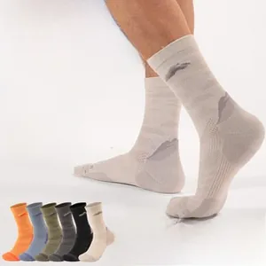 Detailed texture of thick merino wool hiking socks with thermal cushioning and ribbing