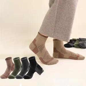 Detailed view of thick merino wool hiking socks showing heel padding and arch support