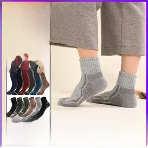 Detail of merino wool hiking socks showing 12 colors and thick knit texture