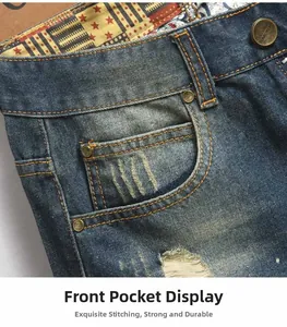 Detail of vintage denim waist with metal button, coin pocket and whisker wash