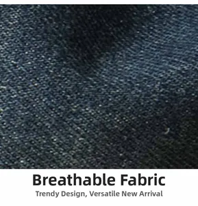 Macro shot of breathable dark denim fabric texture with visible diagonal twill weaving