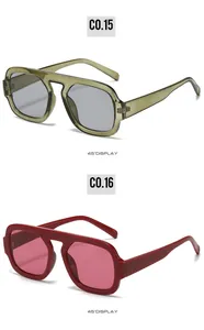 Detailed 45-degree view of pilot sunglasses in olive green and dark red frames