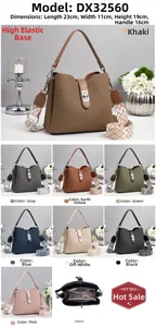 Detail view of large bucket bag with multi-layer interior and wide ethnic shoulder strap
