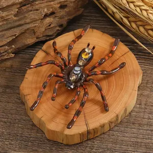 Macro detail of a crystal-encrusted spider brooch on a natural wooden background