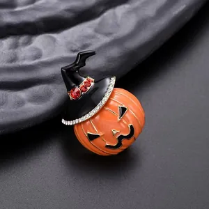 Macro shot of Halloween pumpkin brooch with witch hat and sparkling rhinestones