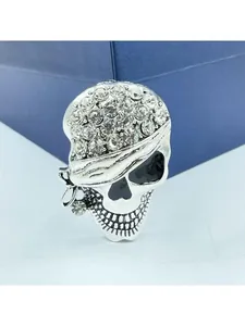 Detailed view of pirate skull brooch with sparkling rhinestones and silver finish