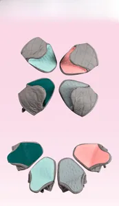Detail showing non-slip fish-scale silicone texture and quilted fabric of oven mitts