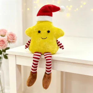 Detail of plush star doll with Christmas hat and striped limbs for holiday decoration