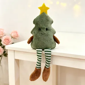 Close-up of a plush Christmas tree doll with striped legs on a festive white table