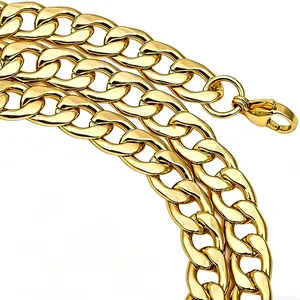 Detailed view of polished golden curb chain with a secure lobster clasp fastening
