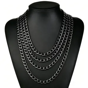 Front detail of a layered gun-black titanium steel curb chain necklace on a bust display