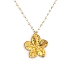 Elegant 18K gold plated flower necklace with white pearl beads and textured metal petals