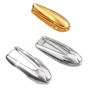 Minimalist teardrop metal earrings in gold and silver finish with polished surface