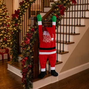 Climbing Santa Claus plush decoration hanging on stairs with festive lights and ribbons