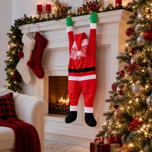 Plush Santa Claus climbing wall decoration hanging over a fireplace in a cozy home