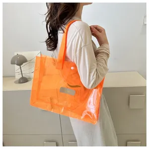 Fashionable orange transparent PVC tote bag shown on shoulder for daily summer style