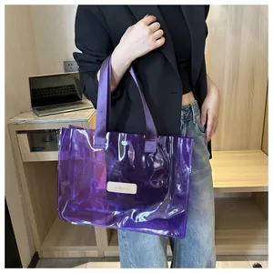 Detail of purple translucent PVC tote bag featuring FA FASHION label and fabric handles