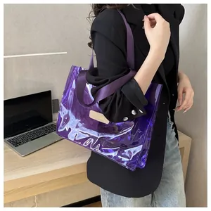 Detail of purple transparent PVC tote bag with holographic finish and fabric strap