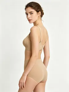 Detailed side view of nude seamless bra and high waist panties on model with slim straps