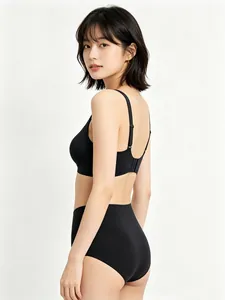 Side view of seamless black wireless bra set with high-waist panties and wide side wings