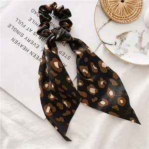 Leopard print satin scrunchie with long ribbon streamers and bow design for women
