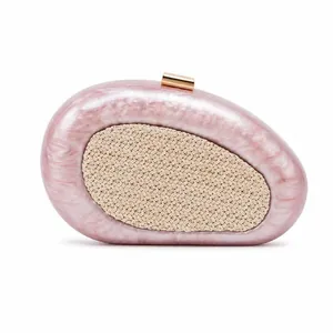 Pink marble acrylic shell clutch bag with woven straw panel and gold metal clasp