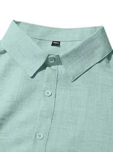 Close-up of mint green cotton linen men's shirt collar with woven fabric texture