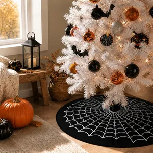 Close-up of Halloween tree skirt with white spider web pattern on black fabric base