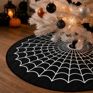 Detail of black Halloween tree skirt with white spider web patterns and cozy festive decor