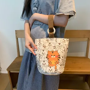 Borsa a secchiello in tela con motivi a tigre cartoon e manico superiore marrone