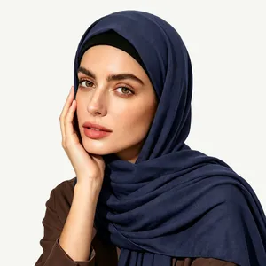 Detail of navy blue ethnic style hijab with double-layer styling and soft fabric texture