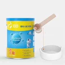 Close-up of baby formula can with measuring scoop and ring accessories on gray background