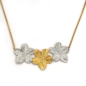 Three-piece plumeria flower pendant necklace in gold and silver finish with box chain