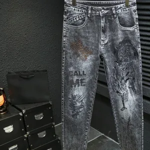 Men's slim fit dark wash street style jeans with graphic print and lettered patterns