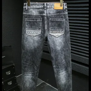 Slim fit men's washed dark grey denim jeans with printed back pockets and leather waist tag
