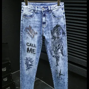 Slim fit light blue denim jeans for men with dragon graphic and letter print design