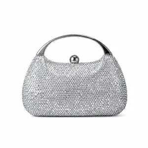Silver glitter evening clutch bag with sparkling rhinestones and metal handle