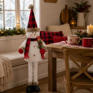 Standing Christmas snowman plush decoration with red and black plaid hat and red ski board