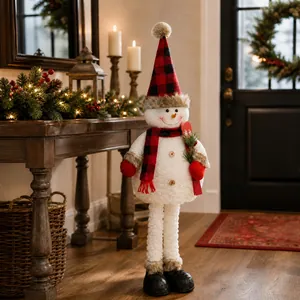Close-up of plush snowman featuring red-black checkered knit hat and white textured body