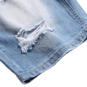 Light blue summer denim shorts featuring distressed ripped details and a loose straight fit