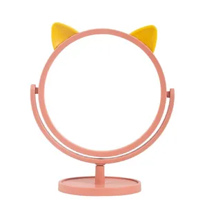 Rotating desktop makeup mirror with pink cat ears and a stable storage base stand