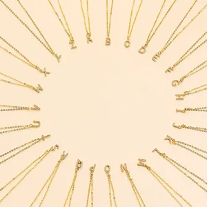 Circular layout of gold initial necklaces with sparkling zircon inlaid letters A to Z