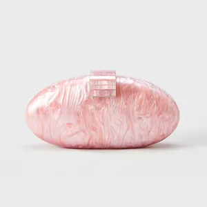 Detail of pink and white marble texture on the oval acrylic shell evening clutch bag