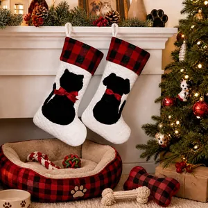 Detail of red black buffalo plaid Christmas pet stockings with cat dog silhouettes