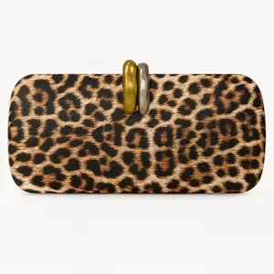 Detailed view of the leopard print evening clutch with a gold and silver interlocking clasp